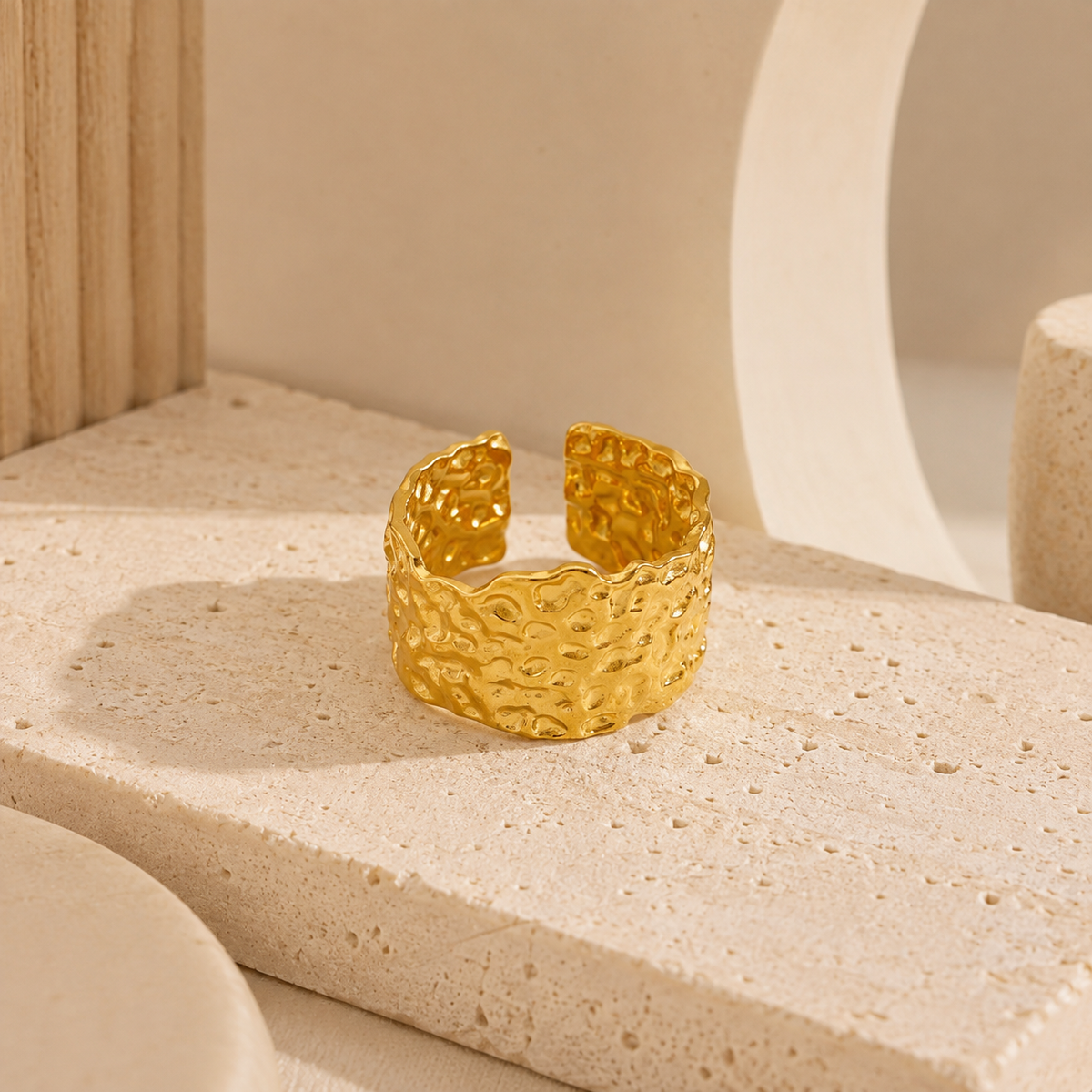 Joū textured sculptural band ring in gold with an open-ended design
