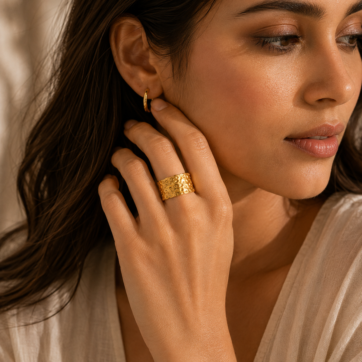 Joū Textured Sculptural Band Ring worn on a model showcasing its bold open-ended design