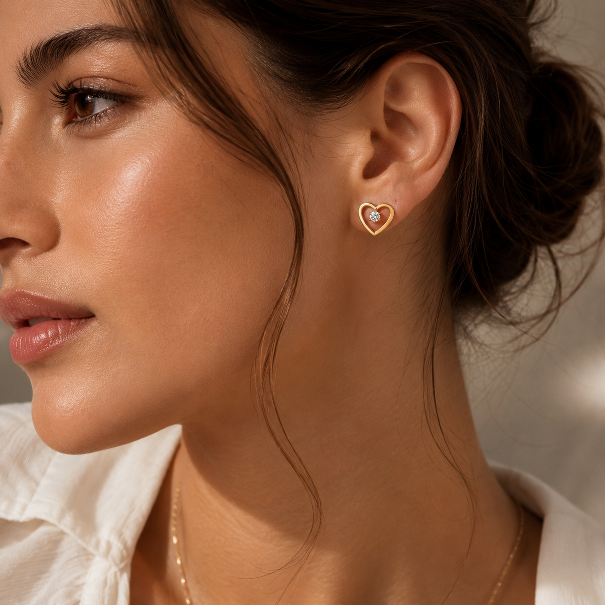 Celestine Studs by JouJule gold heart-shaped earrings styled on model