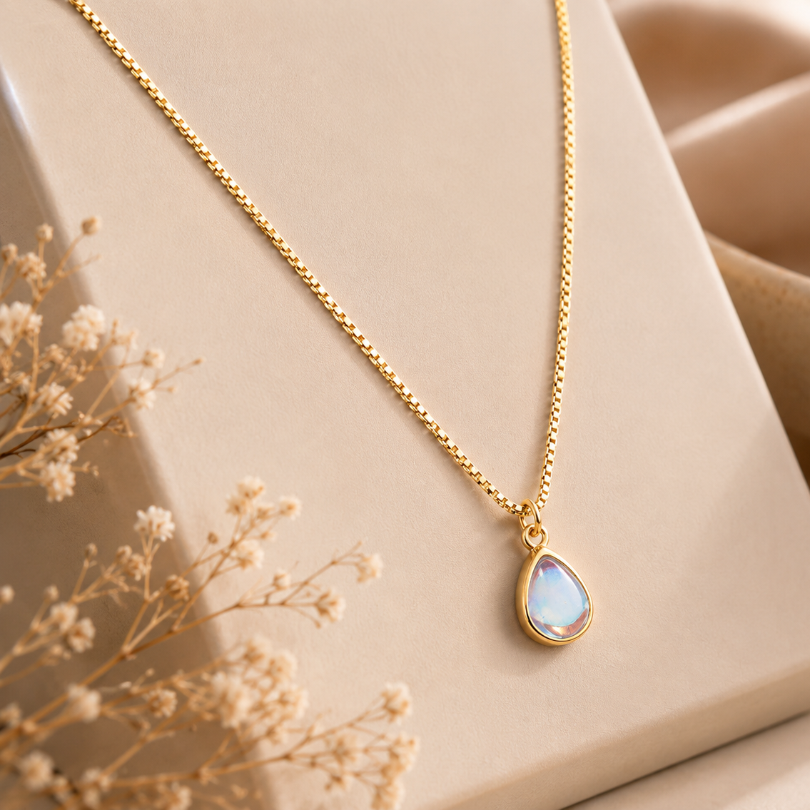 Facet Link by JouJule, gold-tone chain necklace with iridescent teardrop pendant