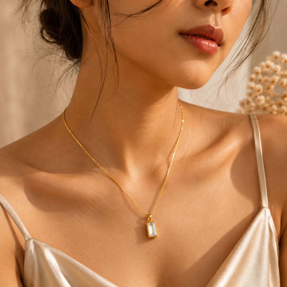 Linear Chain by JouJule gold-tone rectangular pendant necklace styled on model