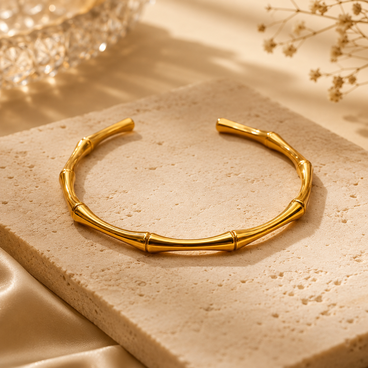 Sculpt Bangle by JouJule, sculptural gold-tone bangle with segmented curved design