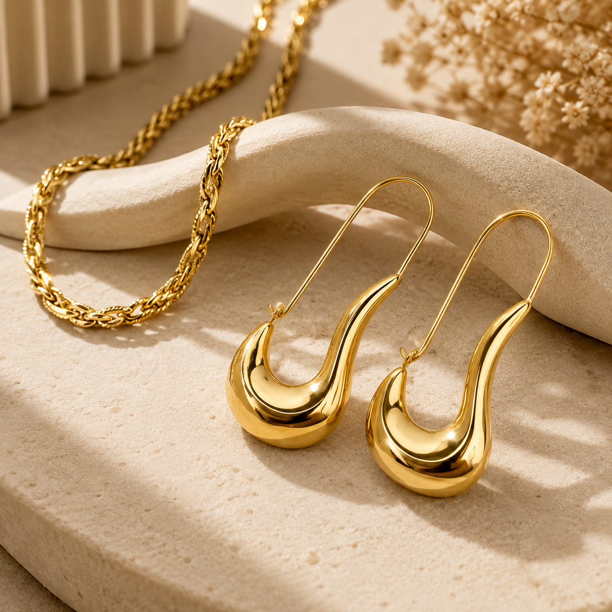 Joū Studs by JouJule, sculptural gold-tone statement earrings with curved U-shaped design